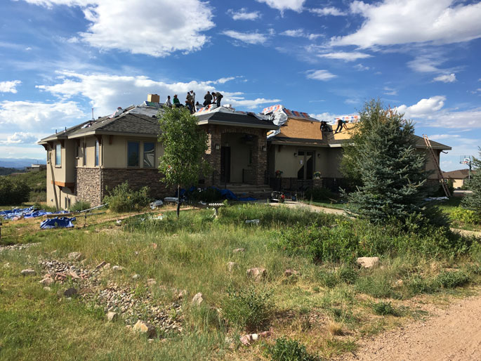 Roof installation team at work